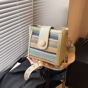 Straw patchwork crossbody bag with wide jacquard strap and wooden button detail