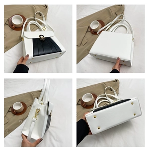 Détail du sac à main bicolore en PU avec fermoir doré et clous de protection en métal