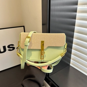 Mint green leather and woven patchwork saddle bag with gold buckle and adjustable strap