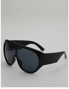 Detail view of the thick black frame and temple of the shield style sunglasses