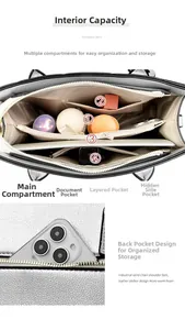 Interior view showing spacious compartments and rear pocket of this silver tote bag