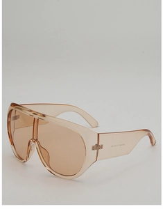 Detail view of large shield sunglasses showing transparent tea resin frames and model code