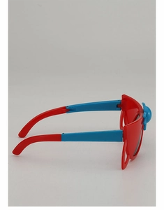 Detail view of foldable kids sunglasses with red frames and blue cartoon nose bridge decoration