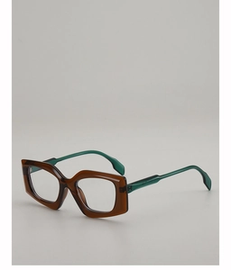Detailed view of geometric thick frame glasses in amber brown and dark green colors