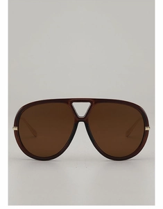 Close-up of oversized aviator sunglasses with a double-bridge and hollow triangle detail
