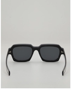 Detail view of thick black square frames and dark lenses with durable metal hinges