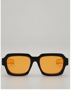 Macro detail of square black frame sunglasses with vibrant orange transparent lenses