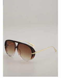 Detail view of aviator sunglasses with brown gradient lenses and gold metal temples