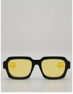 Detailed front view of black rectangular sunglasses with yellow transparent lenses