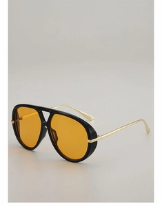 Detail of aviator sunglasses with black frame, orange lenses, and golden metal temples