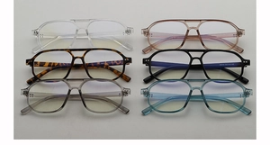 Flat lay of retro double-bridge pilot eyeglass frames in six different assorted colors