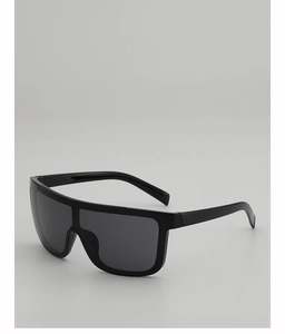 Close-up of matte black shield sunglasses with large oversized dark tinted lenses
