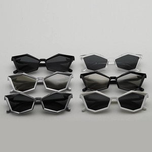Selection of futuristic geometric cat-eye sunglasses in various metallic and matte colors