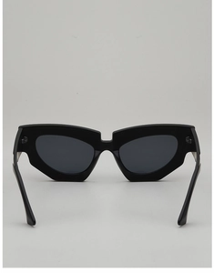 Detailed front view of black geometric cat-eye sunglasses with thick frames and dark lenses