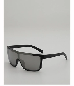 Detail view of large shield sunglasses featuring wide temples and dark monolithic lenses