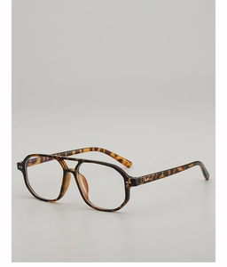 Detail of tortoiseshell pilot frame glasses with metal rivet hinges and polished finish