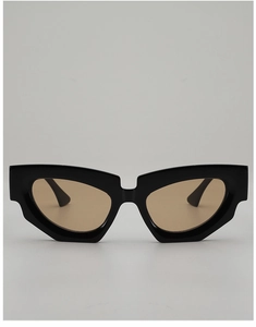 Front view of geometric cat-eye sunglasses with thick black frames and brown lenses