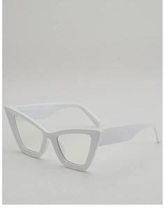 Detail view of white cat-eye sunglasses frame with thick temples and polished finish