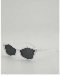 Macro shot of futuristic white pentagon sunglasses with geometric frames and dark lenses