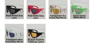 Detail of oversized Y2K sunglasses collection with detachable metal chains and colored lenses