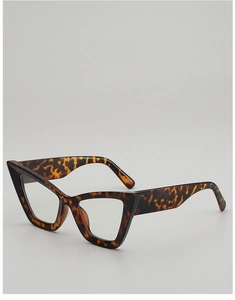 Detail of retro cat-eye sunglasses featuring vintage tortoise shell texture and wide temples