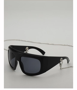 Detail of flat top sunglasses with thick black frames and hanging silver metal chain