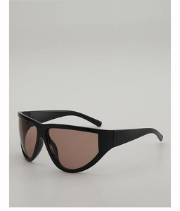 Detail of oversized retro shield sunglasses with black frames and dark brown lenses