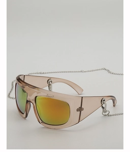 Detail of oversized amber Y2K sunglasses with orange mirror lenses and silver metal chain