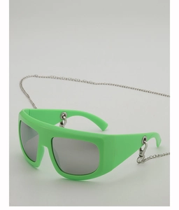 Detail of bright green thick frame sunglasses with a decorative silver metal chain