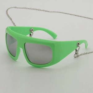 Neon green oversized Y2K sunglasses with silver mirrored lenses and detachable chain