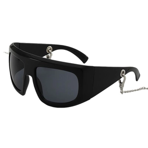 Modern oversized Y2K black sunglasses with silver chain accessory in punk style