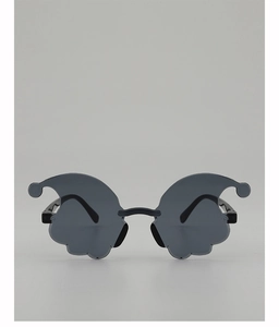 Close-up of black cloud-shaped rimless sunglasses for parties and creative photography