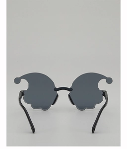 Detail view of clown party glasses with unique cloud-shaped lenses and ball decoration