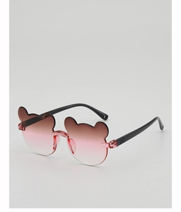 Detail of bear-shaped kids sunglasses with gradient pink lenses and black frames