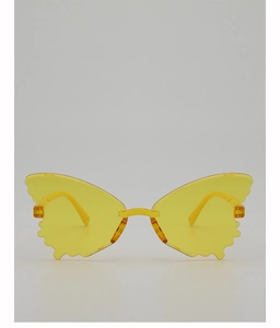 Detail of bright yellow butterfly-shaped rimless sunglasses with wavy scalloped lens edges