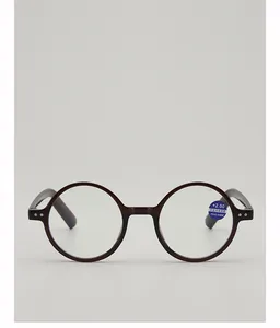 Detail of blue light blocking reading glasses lens with +2.00 power and PD sticker