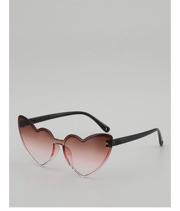 Detail shot of heart shaped sunglasses with pink gradient lenses and black frames