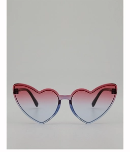 Detail view of heart-shaped sunglasses with red-blue gradient lenses and lilac frame
