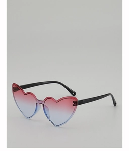 Detail of heart-shaped sunglasses featuring stylish red and blue gradient lenses and black frames