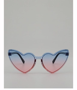 Detail of heart-shaped sunglasses with blue transparent frames and gradient lenses