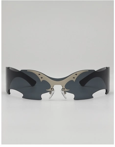 Macro shot of silver metal gothic bat wing detail with rivets on punk shield sunglasses