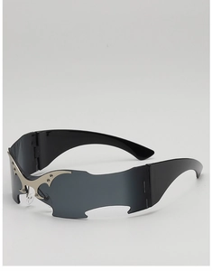 Detail of silver flame metal accents on Y2K rimless batwing wrap sunglasses lenses