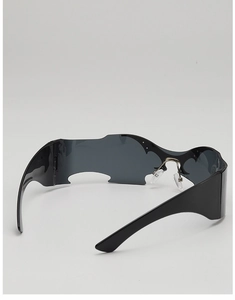 Side view of punk bat-wing sunglasses featuring futuristic frameless lenses and wide temples