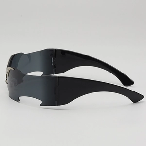 Futuristic Y2K punk style rimless bat wing wrap sunglasses with dark grey lenses