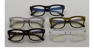 Macro shot of TR90 glasses frames in black, olive green, and clear colors with model details