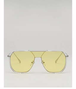 Detail showing transparent frame with yellow lenses and internal metal core structure