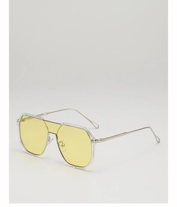 Detailed macro view of yellow lens sunglasses with silver metal frames and clear rim accents