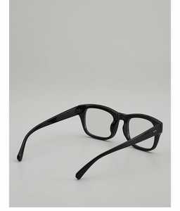 Detail of black full-rim glasses frame with metal hinges and decorative rivets