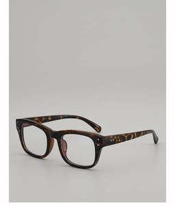 Close-up of classic tortoise shell square eyeglass frames with metal rivet details
