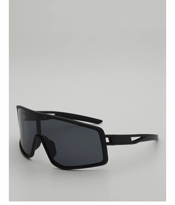 Close-up of matte black cycling sunglasses with large dark grey protective lenses